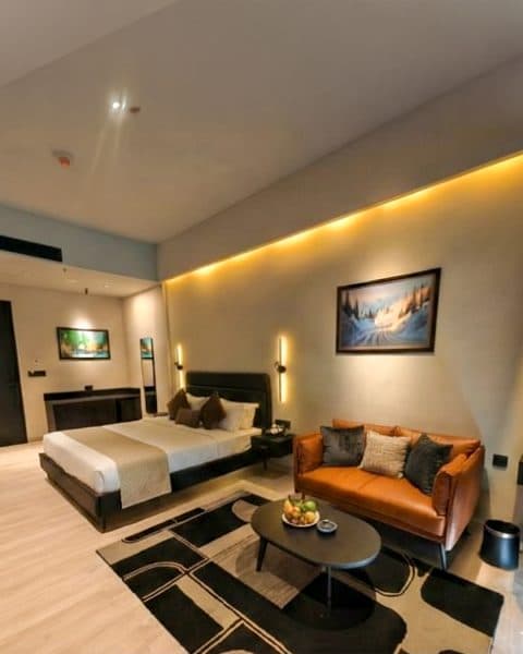 EKAM suite in warm evening light with a leather lounge seat