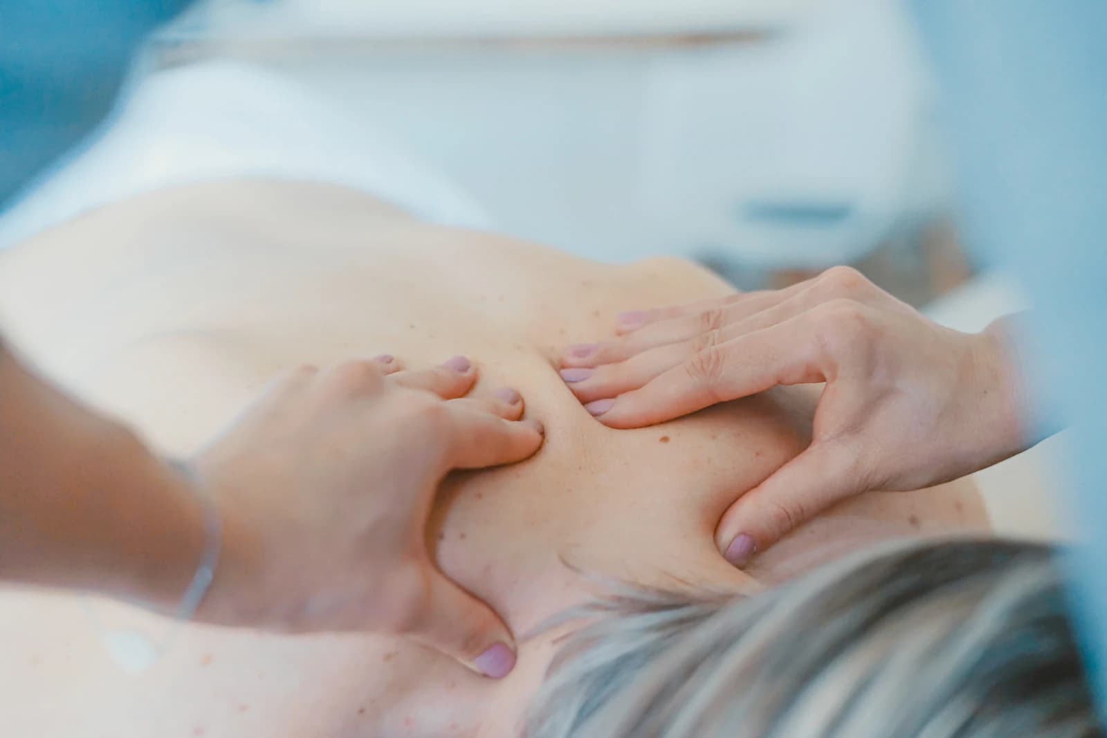A guest receiving hands-on therapeutic care at EKAM