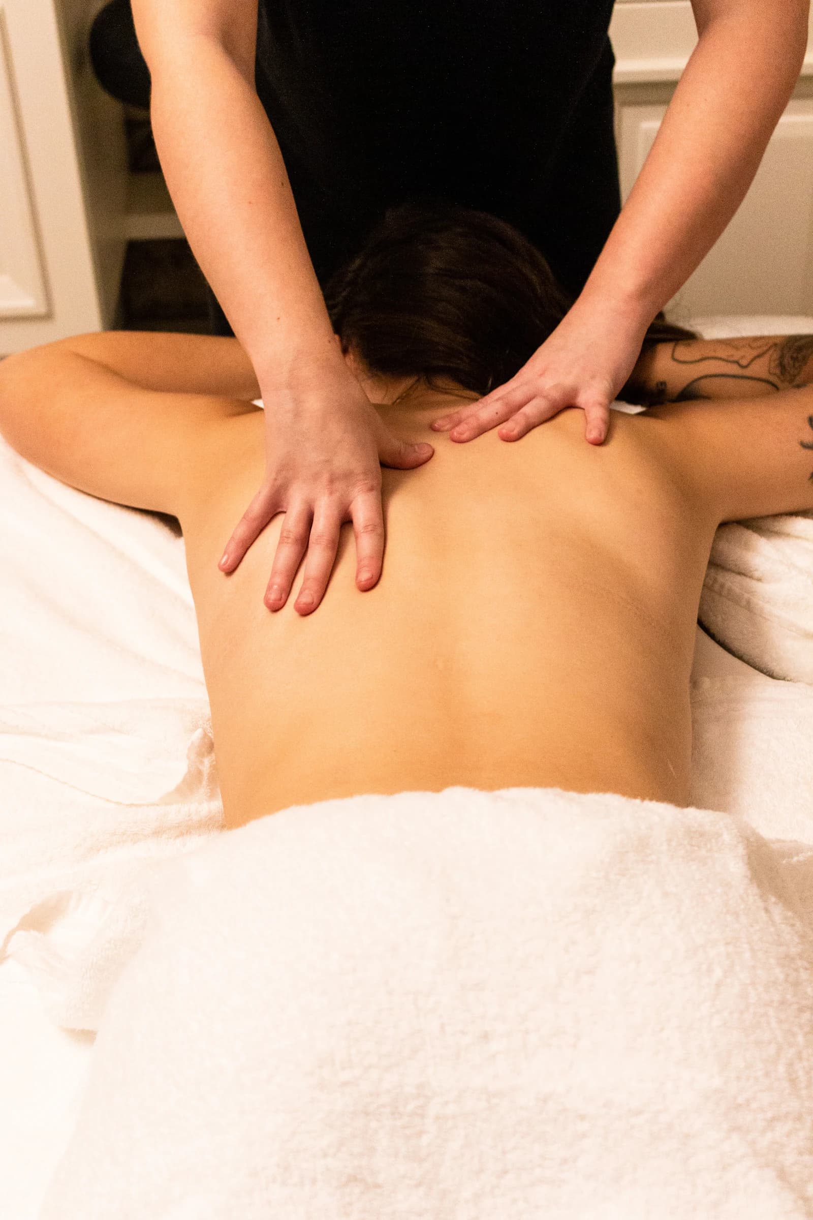 A guest receiving hands-on therapeutic care at EKAM
