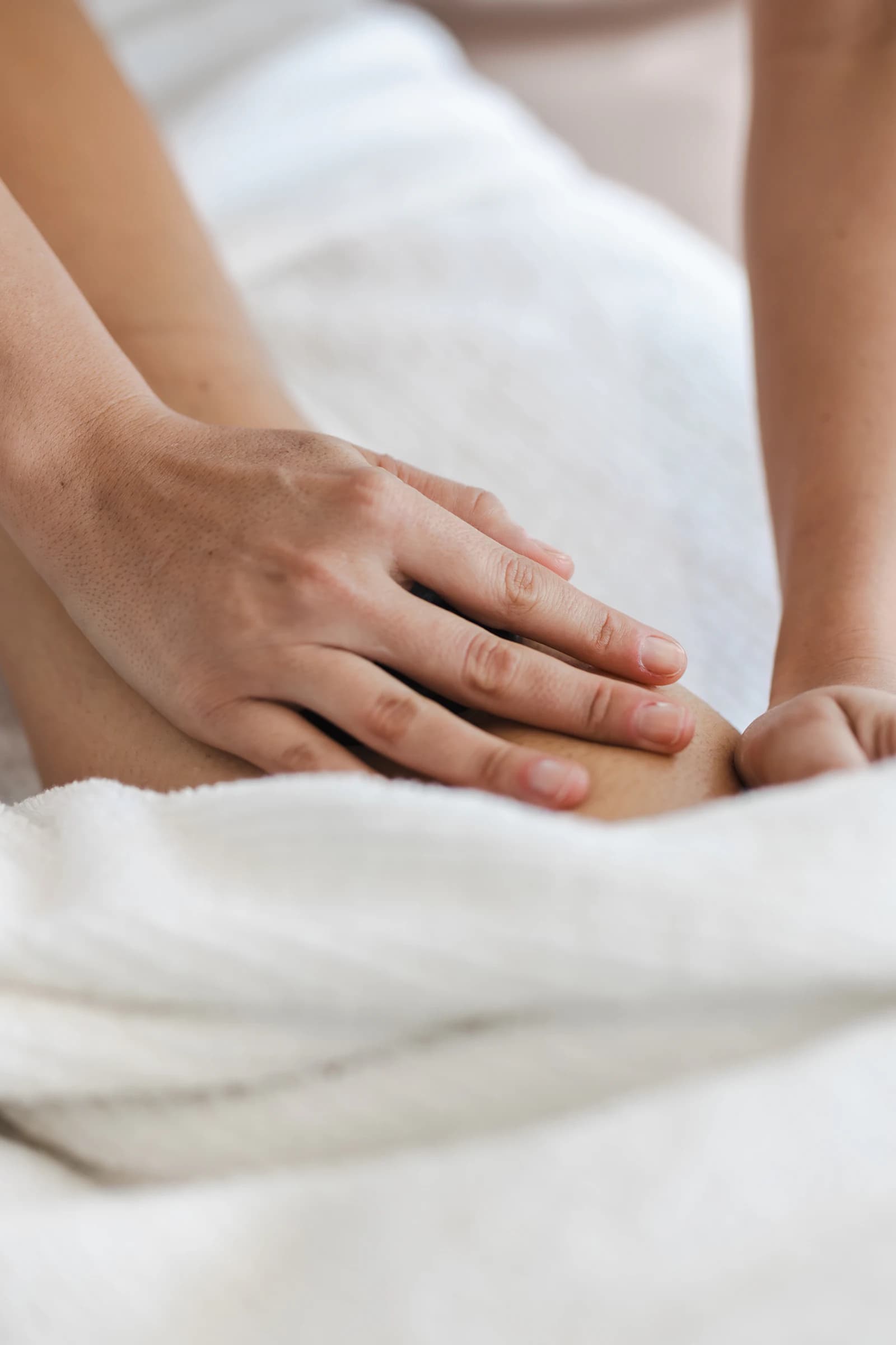 A guest receiving hands-on therapeutic care at EKAM